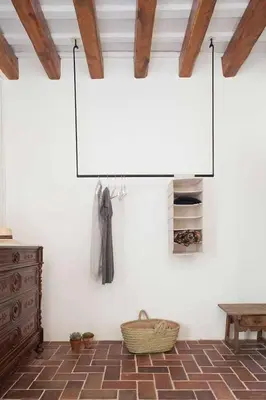 a living room with a fireplace and a glass table at Ca l'Andreu Ecoturisme in Tiana