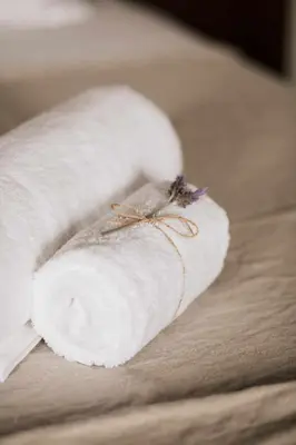 a group of people sitting on a couch in a patio at Ca l'Andreu Ecoturisme in Tiana