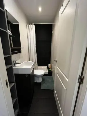 a bathroom with a white sink and a toilet at Private Room Barcelona center in Barcelona