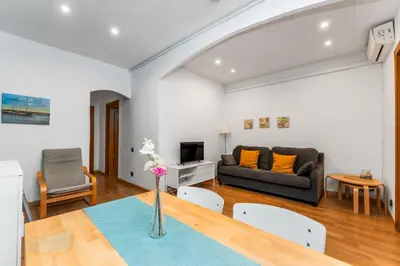 a living room with a couch and a table at Mediterranean and connected in Sant Adria de Besos