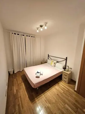 a cupboard with plates and plates on a shelf at Ramblas flat 3Bedroom and Pool Min 32 days in Barcelona