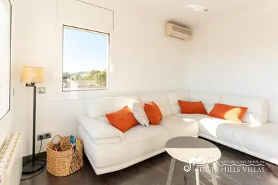 a balcony with a table and chairs and a view at Modern Apartment Lily close to beach with Com Pool and AC in Sitges