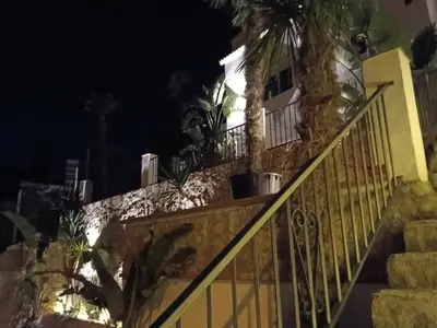 a house on the street at night at Can Masia in Olivella