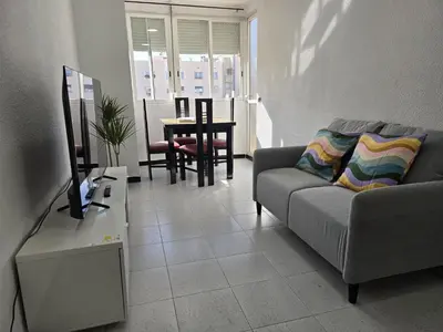 a living room with a couch and a table at A 10 de sagrada familia minutos caminando in Barcelona