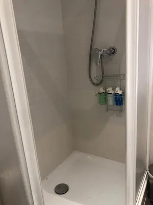 a bathroom with a shower stall with a shower at 1 Casual Apartments in Barcelona