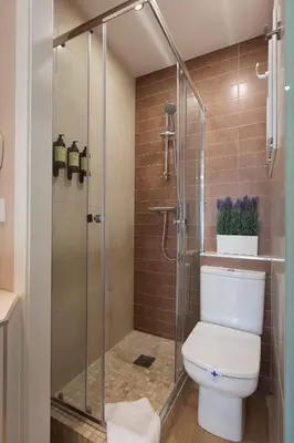 a bath tub with a bed in front of a window at Perfect Romantic Getaway Cozy Retreat with Jacuzzi in Barcelona