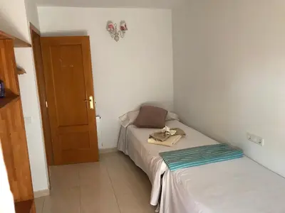 a small room with a bed and a door at House for 8-14 people 25 min from Barcelona, Montserrat, Sitges, Penedes, Sant Cugat in Abrera
