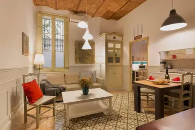 a living room with a couch and a table at Romantic in Trendy Gracia in Barcelona