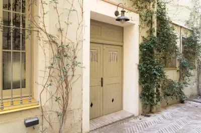 a door on the side of a building at Romantic in Trendy Gracia in Barcelona