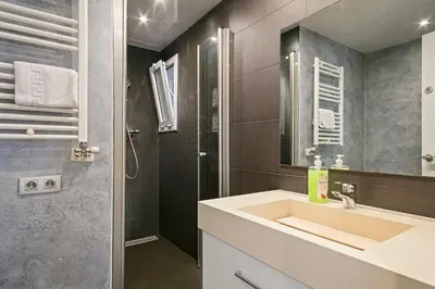 a bathroom with a sink and a shower at Dialez Holidays - Sant Nicasi in Gavà