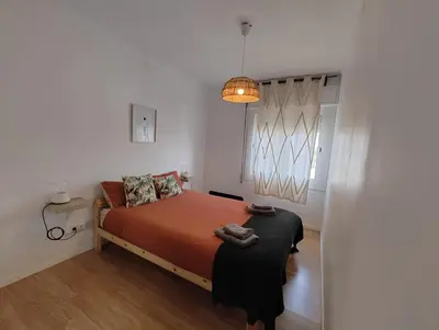a bedroom with a bed and a window at Apartamento en Montgat - Serenity Stays in Montgat