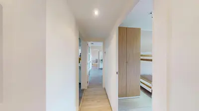 a hallway of a house with white walls at Impressive apartment for 6 in Gracia in Barcelona