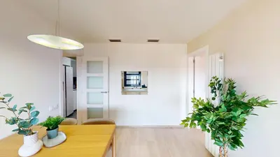 a living room with a table and some plants at Impressive apartment for 6 in Gracia in Barcelona