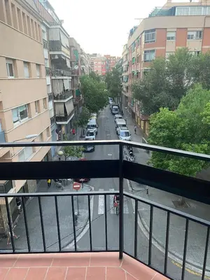 a view of a city street from a balcony at New renovate apartment near of the sea in Barcelona