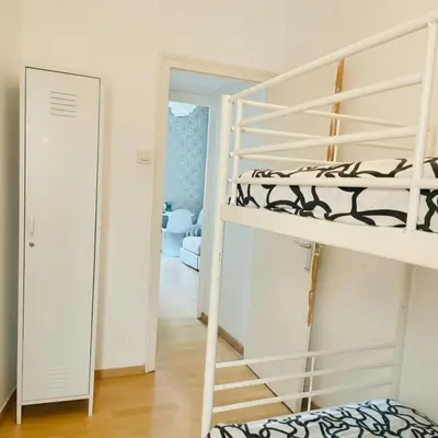 a bunk bed in a room with a mirror at Modern and Elegant Barcelona Apartment in Barcelona