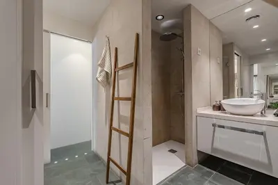 a bathroom with a sink and a toilet and a shower at Sant Joan Design Apartment in Barcelona