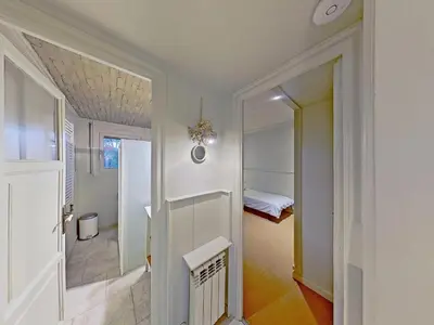 a hallway with a room with a bed and a mirror at Premium Habitat Les Villes in Arenys de Mar