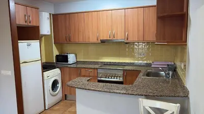 a small kitchen with a sink and a dishwasher at Calle Ramon Berenguer Iv, 13, Sant Pere de Ribes barcelona 08812 in Vilanova i la Geltrú