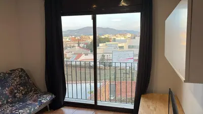 a large window with a view of a city at Calle Ramon Berenguer Iv, 13, Sant Pere de Ribes barcelona 08812 in Vilanova i la Geltrú