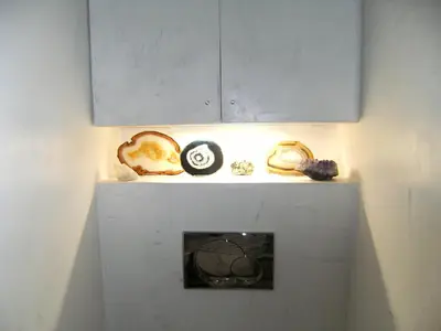 a shelf with various items on it in a room at Blanca Subur in Sitges