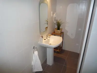a bathroom with a sink and a mirror at 3-Apartament full equiped, next to Mobile Congres in Hospitalet de Llobregat