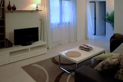 a living room with a tv and a coffee table at 3-Apartament full equiped, next to Mobile Congres in Hospitalet de Llobregat