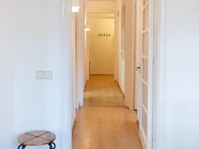 a hallway with white walls and a wooden floor at Apartment amazing Sagrada familia view I in Barcelona