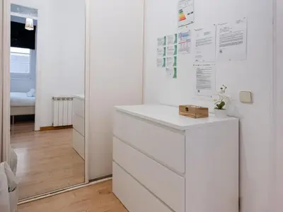 a white room with a dresser and a mirror at Apartment amazing Sagrada familia view I in Barcelona
