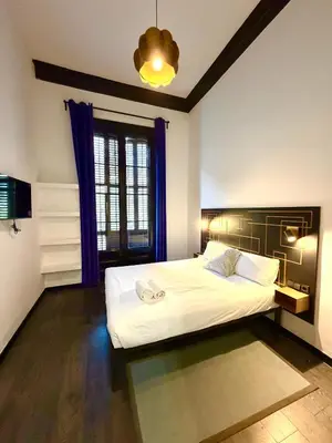 a bedroom with a large white bed and a window at Hotelito Luxe in Barcelona