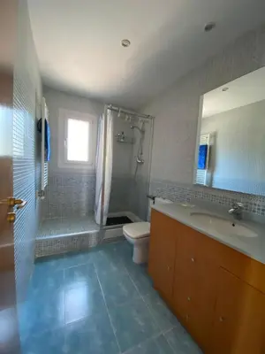 a bathroom with a sink and a toilet and a shower at Shambala B&B in Sitges