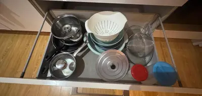 a bunch of utensils are sitting on a shelf at barceloneta street apartment 1 in Barcelona