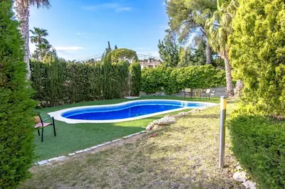 a swimming pool in a yard with trees at Catalunya Casas Costa Dorada Paradise, 2 km from beach! in Cunit