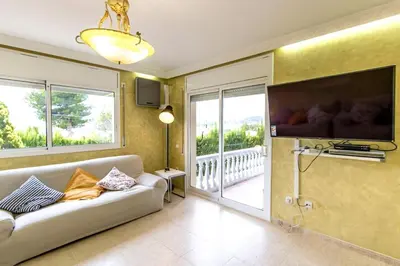 a living room with a couch and a large tv at Catalunya Casas Costa Dorada Paradise, 2 km from beach! in Cunit