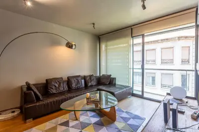 a living room with a couch and a glass table at Apartment Barcelona Rentals - 3 bedroom penthouse with large terrace in Barcelona
