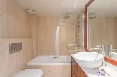 a bathroom with a tub and a sink and a toilet at Apartment Barcelona Rentals - 3 bedroom penthouse with large terrace in Barcelona