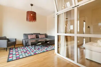 a living room with a couch and a table at Apartment Poble Nou in Barcelona