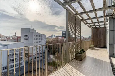a balcony with a view of a city at Canela Homes BARCELONA POBLENOU in Barcelona