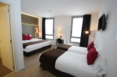 a hotel room with a large bed and a window at HOTEL BESTPRICE Maragall in Barcelona