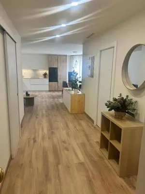an office with a large room with wooden floors at Villa Montjuic Apartments in Barcelona