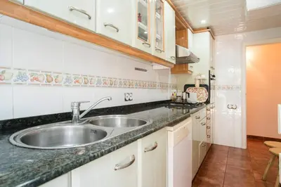 a kitchen with a sink and a counter top at Best sea views, 20 minutes to Barcelona in Montgat