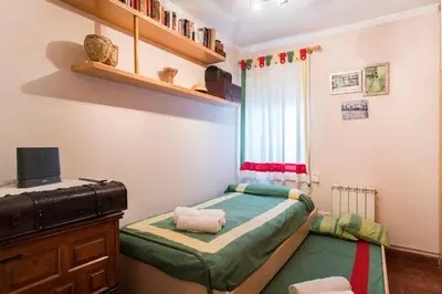 a small bedroom with a bed and a window at Best sea views, 20 minutes to Barcelona in Montgat