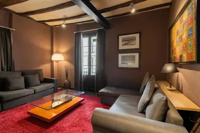 a living room with a couch and a table at Stay U-nique Apartments Pou in Barcelona