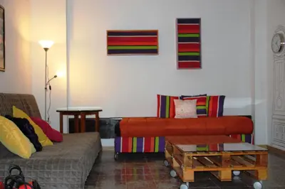 a living room with a couch and a table at Loft Sant Martí - Glories in Barcelona