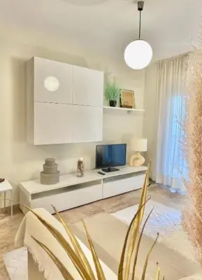 a living room with a desk with a computer on it at Entire Apartment in Barcelona, Camp Nou, Les Corts in Barcelona