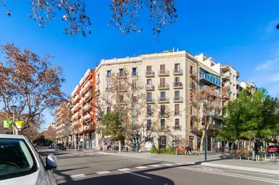 a tall white building on a city street at Downtown penthouse with views of Barcelona in Barcelona