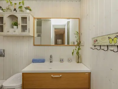 a bathroom with a sink and a mirror and a toilet at Apartment Xaloc by Interhome in Cubelles