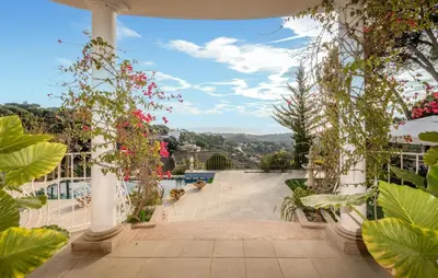 a view from the balcony of a house with flowers at Gorgeous Home In Arenys De Munt in Arenys de Munt