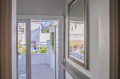 a hallway with a mirror on the wall at Bonaire Penthouse Sitges 2 terraces steps from beach in Sitges