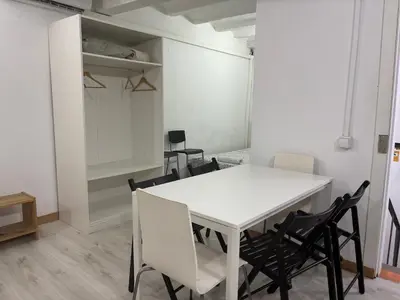 a white table and chairs in a room at 019 principal floor in Barcelona