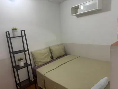 a small room with a bed and a shelf at 019 principal floor in Barcelona